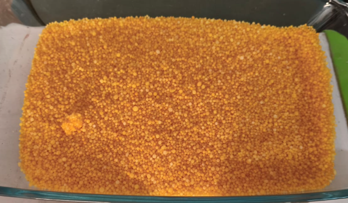 Coated urea granules