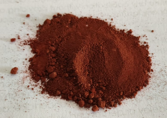 Heap of fine reddish-brown Chevreul's Salt powder